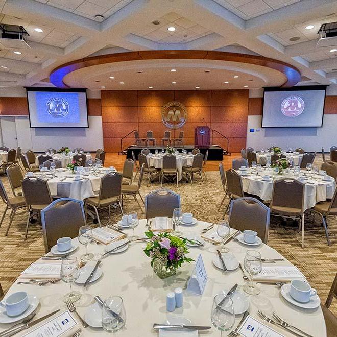 Tables set up for a banquet in Founders Hall